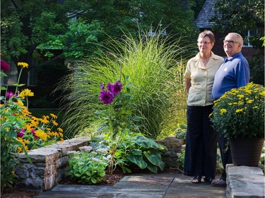 Honorary chair Jim Taggart and Jane Panet enjoy a moment in their front garden.