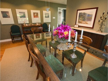 In the dining room, Panet’s traditional chairs are paired with Taggart’s crisp-lined glass and wood dining room table. One of her massive crystal bowls rests on the glass top.