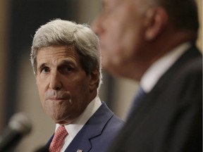 U.S. Secretary of State John Kerry, left, looks at Egypt's Foreign Minister Sameh Shukri during a press conference in Cairo, Egypt, Saturday, Sept. 13, 2014. Kerry arrived in Cairo for a short visit of less than a day to discuss how Egypt can help in the fight against the Islamic State group. He has been on a regional trip to garner support for President Barack Obama�s initiative to assemble a coalition of nations to go after the militant group. Kerry heads to Paris next for a meeting on how to support Iraq in its fight against the Islamic State group, which holds large parts of Iraq and Syria.