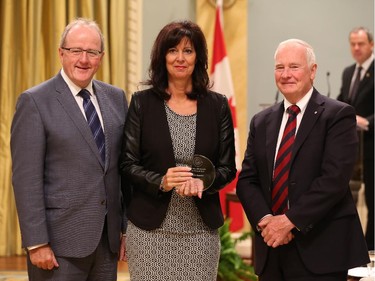 Josée Bessette, receives on behalf of her team, the 2014 Public Service Award of Excellence 2014 for Employee Innovation. The Public Service of Canada recognizes the 10-Year ePassport Team for its commitment to providing Canadians with secure, state-of-the-art travel documents. The new passport's chip-enabled technology saves time and money for travellers, and improves the efficiency of border crossings, all while meeting international best-practice safety standards. The dedicated members of this team collaborated with numerous internal and external stakeholders, consistently exceeded expectations during the course of the project, and found innovative solutions to ensure national security and the safety of Canadians. Thanks to the team's hard work and perseverance, the ePassport is the most secure travel document ever issued in Canada.