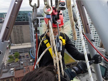 Kalpana Phansalker is all harnessed up as participants rappel from the top of the Morguard Building at 280 Slater Street in the 5th annual Drop Zone Ottawa event which raises money for Easter Seals. September 22, 2014.