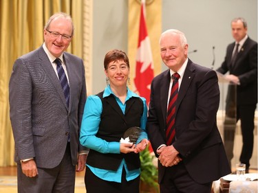 Kimberly Lavoie, receives on behalf of her team, the 2014 Public Service Award of Excellence 2014 for Excellence in Policy. The Public Service of Canada salutes the team behind the Aboriginal Community Safety Planning Policy Initiative, which has been instrumental in creating safer communities for Aboriginal people. The team partnered with several federal departments, different levels of government and Aboriginal communities to help develop and implement community-specific plans to reduce violence. The team's sustained commitment and respectful approach have helped to rebuild trust in government and facilitated community mobilization, which has created conditions for lasting and positive changes. The success of this initiative attracted funding from various levels of government, including Aboriginal governments, and continues to draw acclaim from other departments.