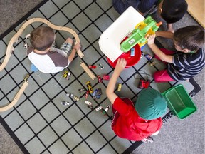 Kindergarten isn't all about work, as these students at Robert E. Wilson school discover.