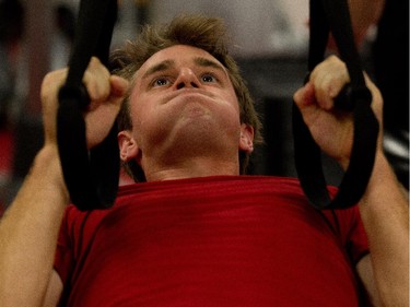 Kyle Turris does pull ups as the Ottawa Senators are given medicals and tested for strength and conditioning.