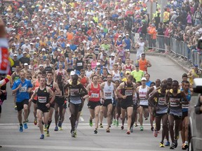 Marathoners start the race up Elgin Street during Ottawa Race Weekend Sunday May 25, 2014.