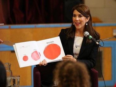 Mary, Crown Princess of Denmark, reads a book to children of the Centennial Public School.