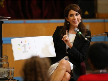 Mary, Crown Princess of Denmark, reads a book to children of the Centennial Public School.