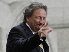 Ukrainian-Canadian businessman Eugene Melnyk, owner of the NHL's Ottawa Senators, stands in the visitors gallery as he is recognized in the House of Commons at the conclusion of Question Period on Parliament Hill, in Ottawa Tuesday, March 4, 2014 THE CANADIAN PRESS/Fred Chartrand