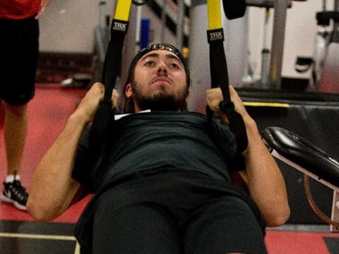 Mika Zibanejad does a horizontal pull-up as the Ottawa Senators are given medicals and tested for strength and conditioning.