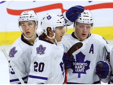 Toronto Maple Leafs defenceman (44) celebrates his goal with forwards David Booth (20) and Sam Carrick during third period NHL pre-season action against the Ottawa Senators in Ottawa on Wednesday, September 24, 2014. The Senators beat the Maple Leafs 3-2.