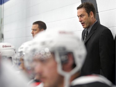 Ottawa 67's rookie head coach Jeff Brown behind the bench during pre-season junior hockey action vs. Gatineau Olympiques at the Nepean Sportsplex in Ottawa, Saturday, September 6, 2014.