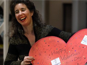 Angela Hewitt holds a big Valentine presented to her by the OrKidstra players in 2012.