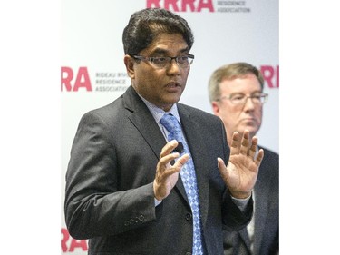 Ottawa mayoral candidate, Anwar Syed, speaks during an all-candidates mayoral debate while incumbent, Jim Watson, looks on at the Carleton University Residence Commons Tuesday September 23, 2014.
