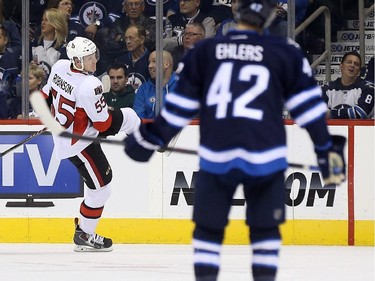 Ottawa Senators' Buddy Robinson (55) celebrates after scoring on a breakaway against the Winnipeg Jets during second period pre-season NHL hockey action in Winnipeg, Tuesday, September 30, 2014.