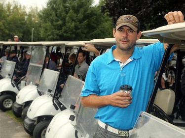 Ottawa Senators' Chris Phillips awaits tee time with a coffee. Hockey players, coaches and some happy fans all got out their clubs for the Ottawa Senators annual golf tournament, held Wednesday, Sept. 17  at the Rideau View Country Club in Manotick.