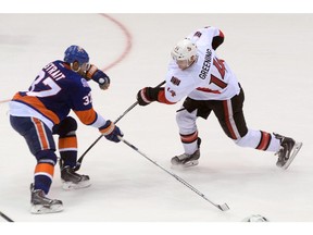 Ottawa Senators Colin Greening takes a shot past N.Y. Islanders Brian Strait during second period pre-season NHL action in St. John's, N.L. on Monday September 22, 2014.