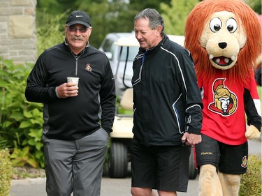 Ottawa Senators Head Coach, Paul MacLean (left) seemed in a good mood as he chatted with club coach, Paul Sherritt (right) and strolled with Spartacat. Hockey players, coaches and some happy fans all got out their clubs for the Ottawa Senators annual golf tournament, held Wednesday, Sept. 17  at the Rideau View Country Club in Manotick.