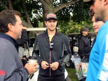 Ottawa Senators player Zach Smith (centre) chats with other players and golfers before the game got underway. Hockey players, coaches and some happy fans all got out their clubs for the Ottawa Senators annual golf tournament, held Wednesday, Sept. 17  at the Rideau View Country Club in Manotick.