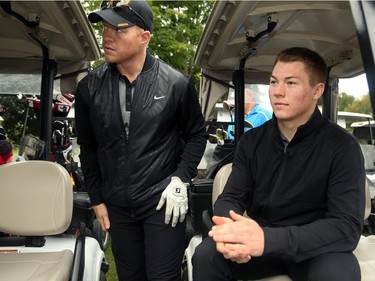 Ottawa veteran Chris Neil (left) gets into his cart alongside newcomer Curtis Lazar (right). Hockey players, coaches and some happy fans all got out their clubs for the Ottawa Senators annual golf tournament, held Wednesday, Sept. 17  at the Rideau View Country Club in Manotick.