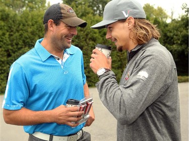 Ottawa's Chris Phillips (left) and  Erik Karlsson share a laugh before the game got underway. Hockey players, coaches and some happy fans all got out their clubs for the Ottawa Senators annual golf tournament, held Wednesday, Sept. 17  at the Rideau View Country Club in Manotick.