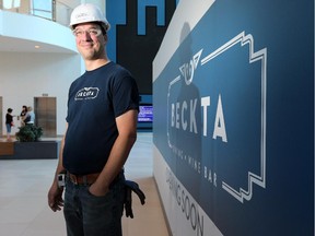 Owner Stephen Beckta beside his restaurant's new logo, featuring a the shape of the windows and a pair of swans engraved into the historic building's staircase. Construction continues on the new Beckta on Elgin Street in downtown Ottawa. (Julie Oliver / Ottawa Citizen)