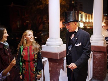 Pat Holloway greets people at Rectory House during Nuit Blanche in Ottawa, on Saturday, September 20, 2014.