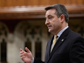 Parlimentary secretary to the Prime Minister Paul Calandra responds to a question during question period in the House of Commons on Parliament Hill in Ottawa on Friday, Nov. 29, 2013.