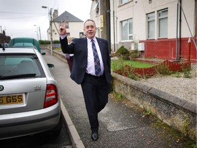 First Minister Alex Salmond gestures as he walks to meet with supporters on September 18, 2014 in Turriff, Scotland. After many months of campaigning the people of Scotland today head to the polls to decide the fate of their country.
