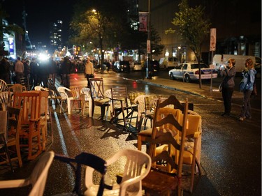 People take a photo of a labrynthe of chairs on George St. during Nuit Blanche in Ottawa, on Saturday, September 20, 2014.