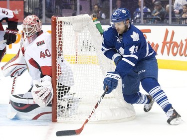 Toronto Maple Leafs forward Nazem Kadri, right, attempts a wrap around against Ottawa Senators goalie Robin Lehner during second period pre-season NHL hockey action in Toronto on Wednesday, September 24, 2014.