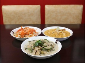Papaya salad and two curries (Massaman and green chicken curry) at Sam's Cafe in Fairmont Confectionery.  (Jean Levac/ Ottawa Citizen)