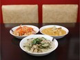 Papaya salad and two curries (Massaman and green chicken curry) at Sam's Cafe in Fairmont Confectionery.  (Jean Levac/ Ottawa Citizen)