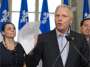 PQ MLA Jean-Francois Lisee, centre, on Tuesday July 15, 2014.