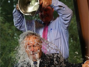 Sir Terry Matthews takes the ALS ice bucket challenge at the Marshes Golf Club in Ottawa, Sept. 2, 2014.