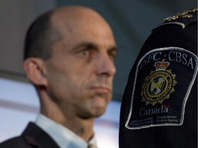 Public Safety Minister Steven Blaney listens to a speaker during a Canada Border Services announcement at the airport, Thursday September 12, 2013 in Ottawa.