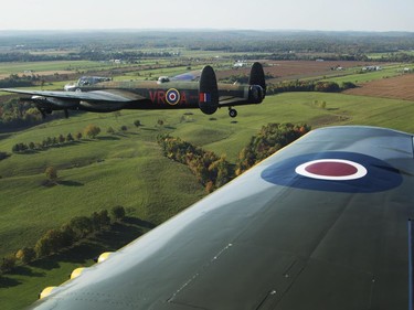 The Canadian Warplane Museum's Avro Lancaster bomber is escorted back to Vintage Wings of Canada at the Gatineau Airport, Sept. 27, 2014.