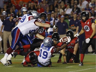 The Montreal Alouettes' S.J. Green is tackled by the Ottawa Redblacks in CFL action at TD Place on Sept. 26, 2014.