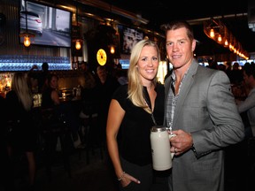 Ottawa Senators player Chris Neil with his wife, Caitlin, on Thursday, Sept. 11, 2014, in Kanata at the grand opening of Central Bierhaus, a new Bavarian inspired gastro–sports pub that he's part-owner of.