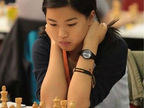 Qiyu Zhou went undefeated in capturing the under-14 title at the world youth chess championships.