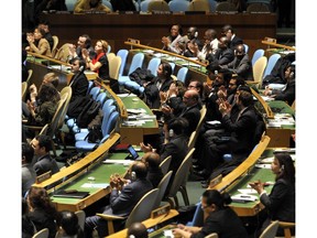 Delegates to the United Nations General Assembly April 2, 2013 applaud the passage of the first UN treaty regulating the international arms trade.