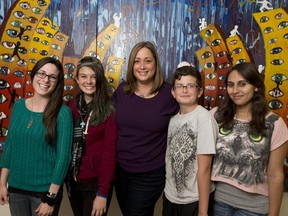 Isabelle Rivard poses with Youth Net facilitator Myriam Charbonneau, Rachel and Josh, and facilitator Fiona Cooligan. Rivard is a manager in the federal government and credits a lot of her success to Youth Net.