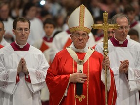 Pope Francis leaves at the end of a mass and the celebration on several weddings at St Peter's basilica on September 14, 2014 at the Vatican.