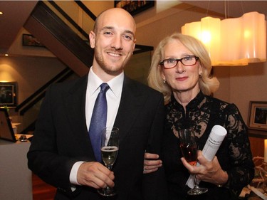 Volunteer organizer Laura Chapman from the Hospice Care Ottawa's Homes for the Holidays 2014 with her son, Nick Paget, at a fundraising party held Wednesday, Sept. 17, 2014, at the penthouse level of 700 Sussex Drive.