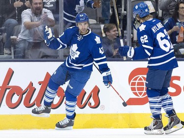 Toronto Maple Leafs forward Nazem Kadri, left, celebrates his goal with teammate William Nylander, right, while playing against the Ottawa Senators during first period pre-season NHL hockey action in Toronto on Wednesday, September 24, 2014.