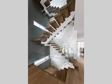 A staircase that appears to float paired with a feature wall in funky geometric shapes netted Design First Interiors the award for housing details. The stairs are part of a project that netted four awards for the design firm.