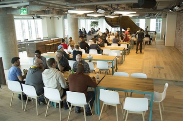 A cafeteria is photographed in the new Shopify offices at 150 Elgin St. in Ottawa Friday, October 17, 2014. Each coloured cabin-like structure is a work-space where employees can meet in private or work. (Darren Brown/Ottawa Citizen)