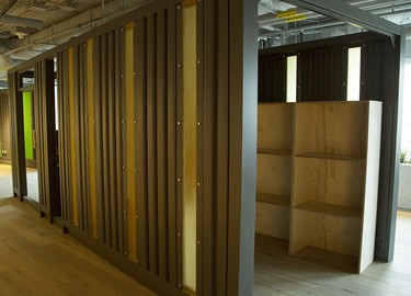 A shipping container is re-imagined in the new Shopify offices at 150 Elgin St. in Ottawa Friday, October 17, 2014. Each coloured cabin-like structure is a work-space where employees can meet in private or work. (Darren Brown/Ottawa Citizen)