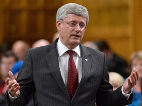 Prime Minister Stephen Harper responds to a question during Question Period in the House of Commons, Wednesday, Oct.1, 2014 in Ottawa. THE CANADIAN PRESS/Sean Kilpatrick