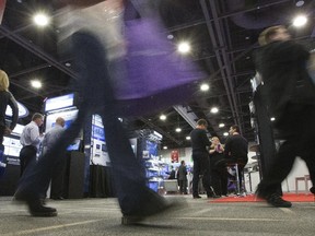 People attend the 22nd Government Technology Exhibition and Conference at the Shaw Centre Thursday.