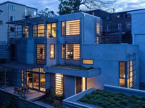 Although on a slim lot, the house is set on one side to leave the south side open to decks, gardens and series of window trellises that will eventually support a green privacy curtain of vines.